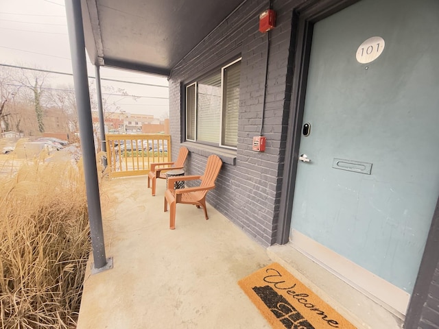 entrance to property featuring covered porch