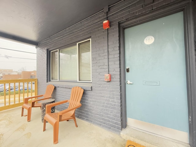 doorway to property with covered porch