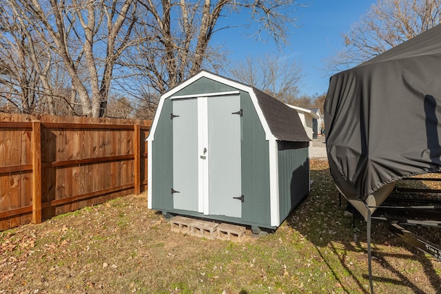 view of outbuilding featuring a lawn