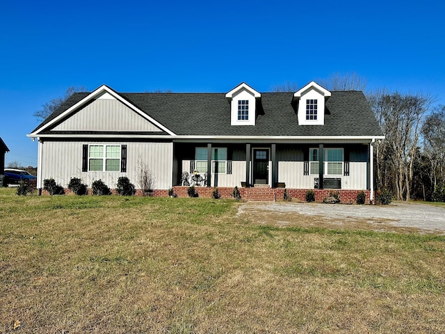 view of front of property with a porch and a front yard