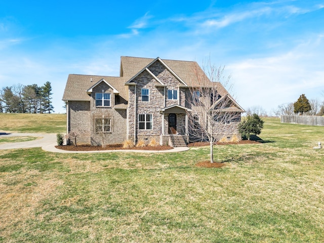 craftsman-style home featuring a front yard