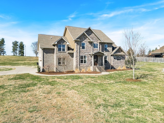 craftsman-style home featuring a front lawn