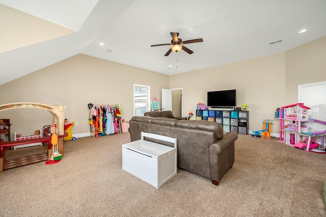 carpeted living room featuring vaulted ceiling and ceiling fan