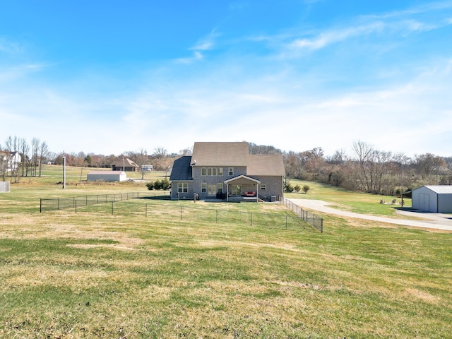 view of yard with a rural view