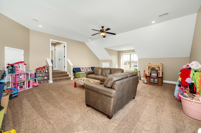 carpeted living room featuring ceiling fan and vaulted ceiling