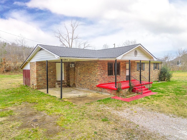 single story home with a patio area and a front yard