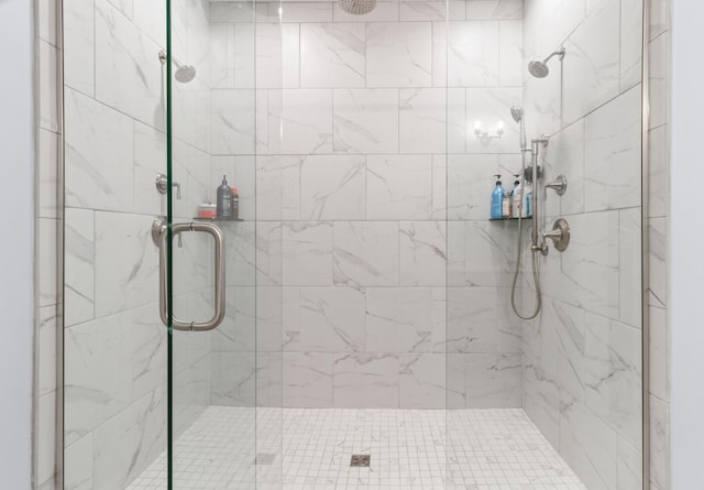 bathroom with a shower with shower door