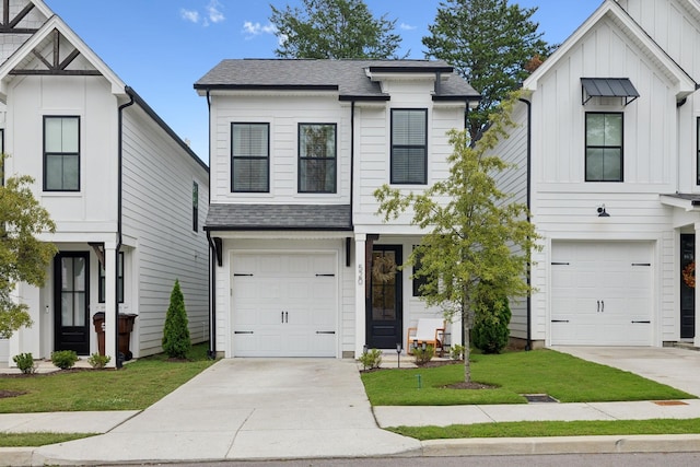 view of front of home featuring a garage and a front lawn