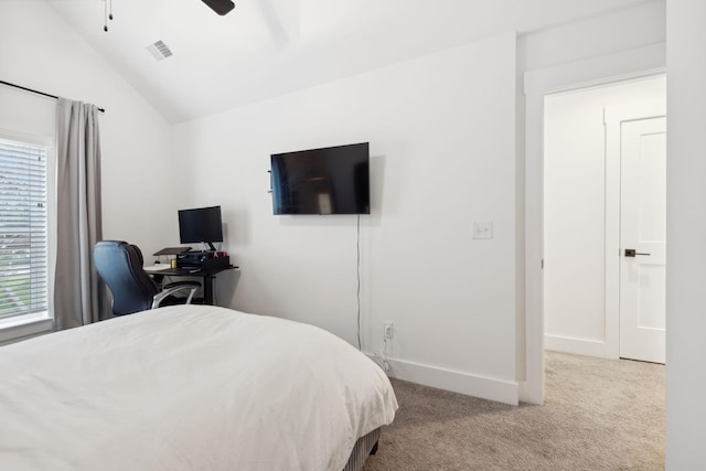 carpeted bedroom with ceiling fan, lofted ceiling, and multiple windows