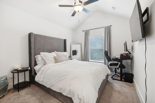 bedroom featuring light colored carpet, vaulted ceiling, and ceiling fan