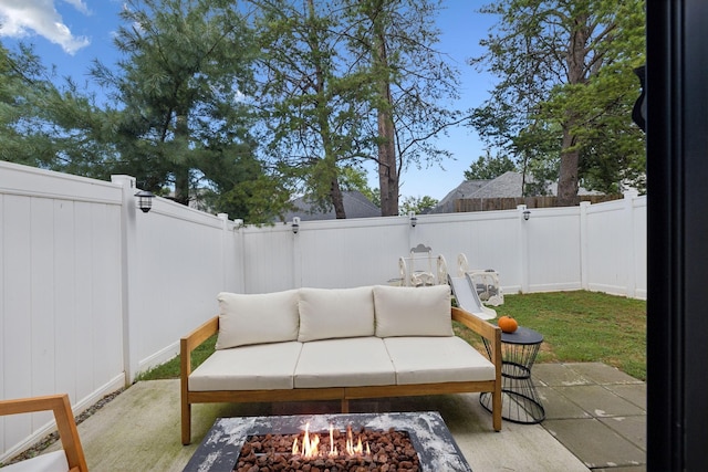 view of patio / terrace with an outdoor fire pit