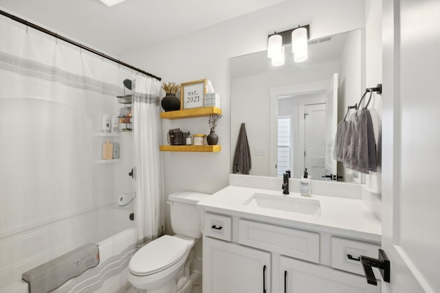 full bathroom featuring vanity, toilet, and shower / bathtub combination with curtain