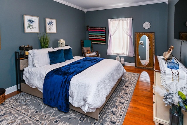 bedroom featuring crown molding and hardwood / wood-style floors