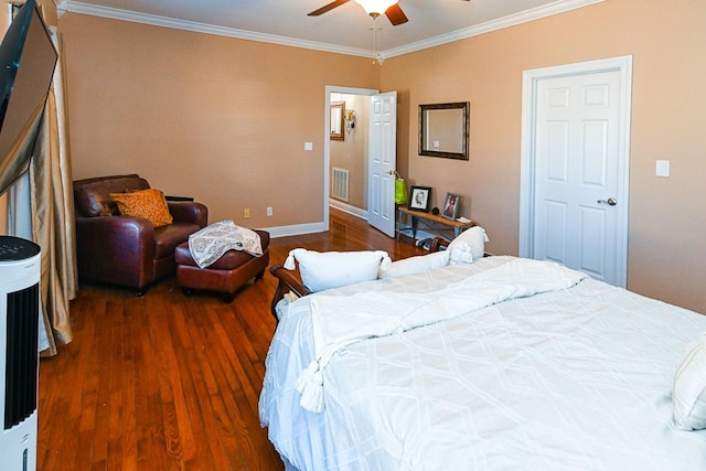 bedroom with crown molding, ceiling fan, and dark hardwood / wood-style flooring