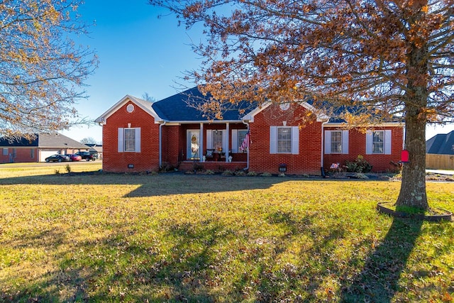 ranch-style house with a porch and a front lawn