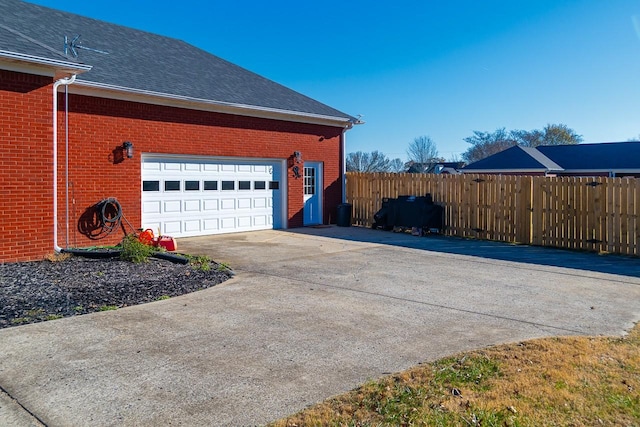 view of side of property featuring a garage