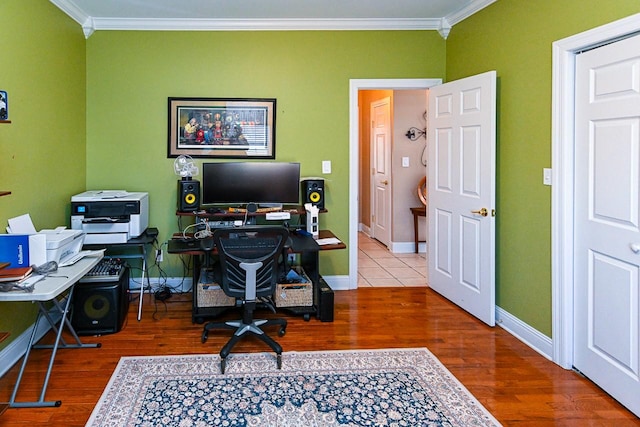 home office featuring ornamental molding and hardwood / wood-style floors