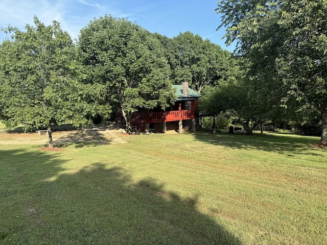 10795 Back Piney Rd, Bon Aqua, TN 37025 - view of grassy yard with a wooden deck and a view of trees