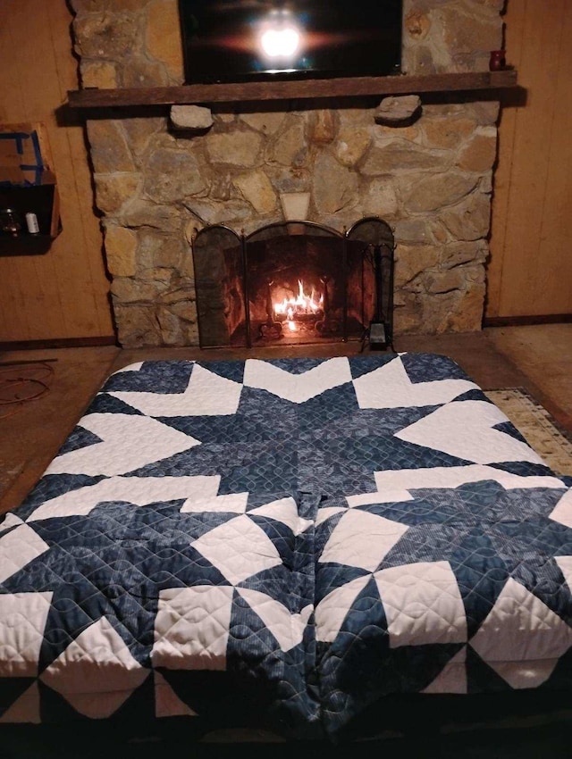 room details with a fireplace and wooden walls