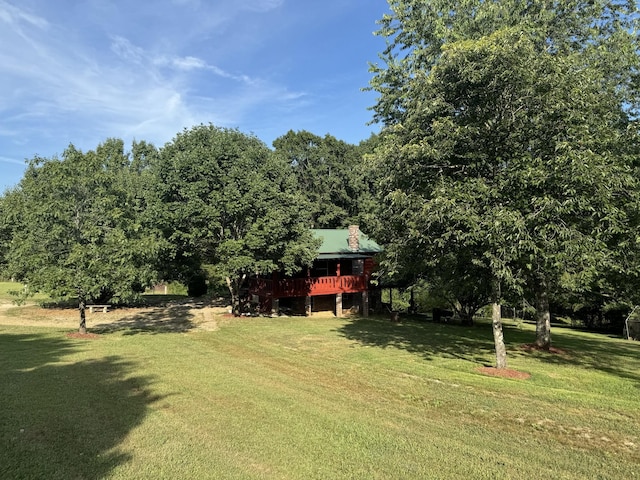 view of yard featuring a wooden deck