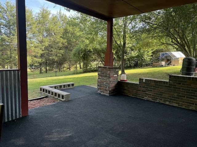 10795 Back Piney Rd, Bon Aqua, TN 37025 - view of patio featuring an exterior structure, an outbuilding, and view of wooded area