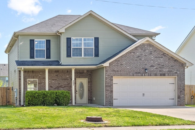 front of property featuring a front yard and a garage