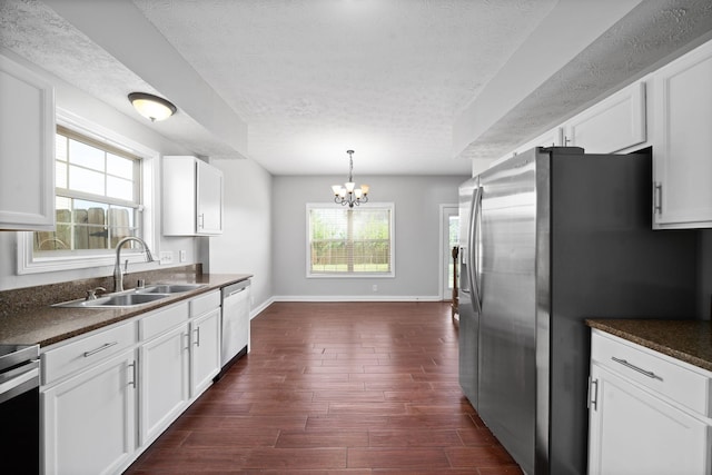 kitchen with white cabinets and plenty of natural light