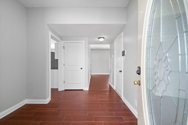 hallway featuring dark wood-type flooring