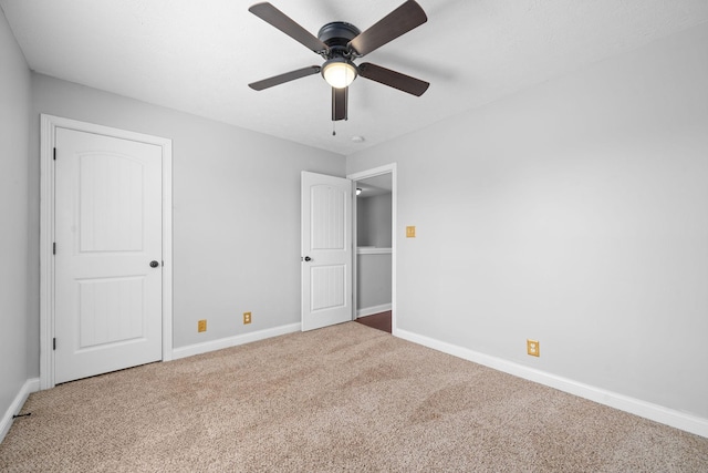 unfurnished bedroom with carpet floors and ceiling fan