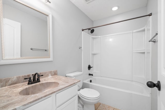 full bathroom featuring  shower combination, vanity, a textured ceiling, and toilet