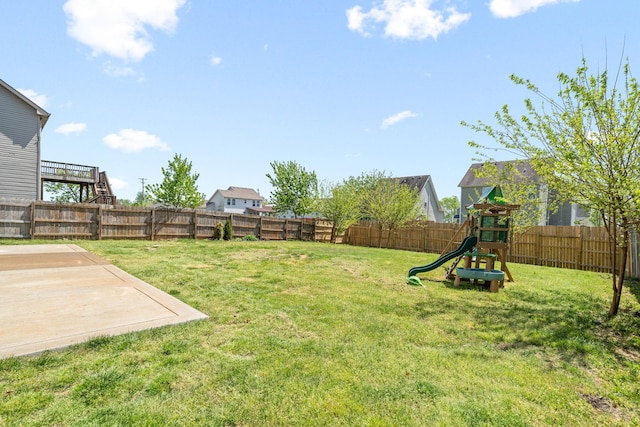 view of yard with a playground and a patio area