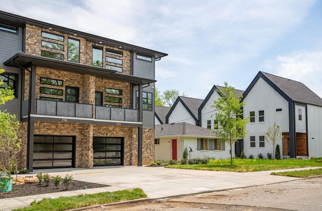 contemporary home featuring a balcony and a garage