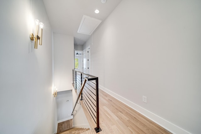 stairway with hardwood / wood-style floors