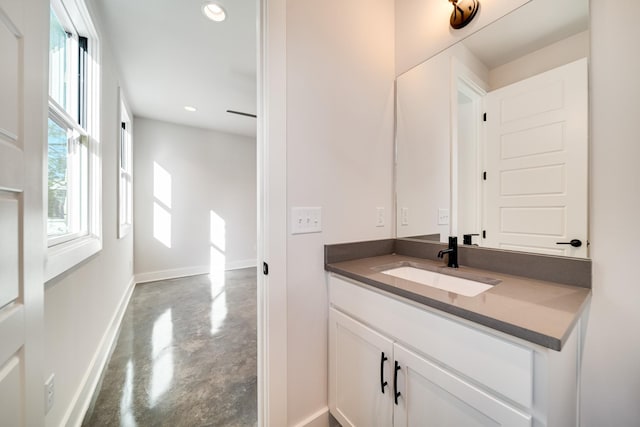 bathroom with vanity and concrete floors