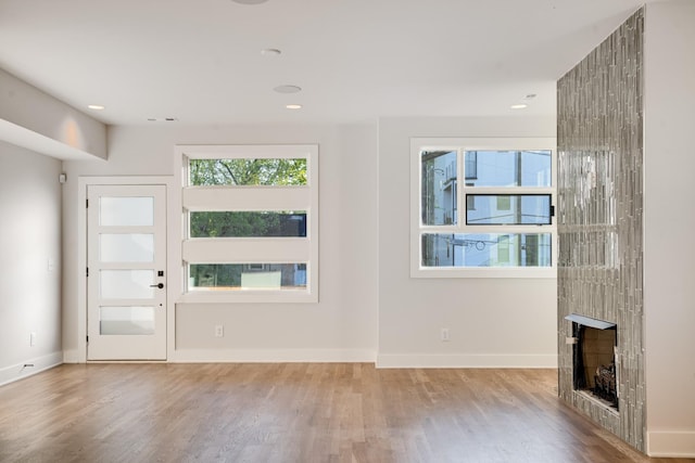 unfurnished living room with hardwood / wood-style floors