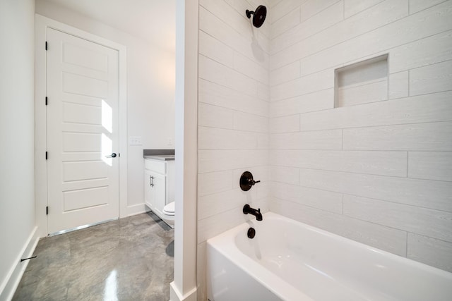 full bathroom with vanity, concrete floors, toilet, and tiled shower / bath