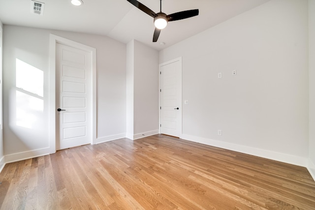 unfurnished bedroom featuring vaulted ceiling, light hardwood / wood-style flooring, and ceiling fan