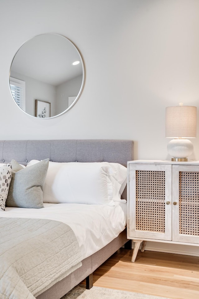 bedroom with hardwood / wood-style floors