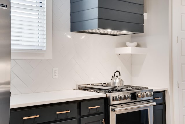 kitchen with stainless steel appliances and tasteful backsplash