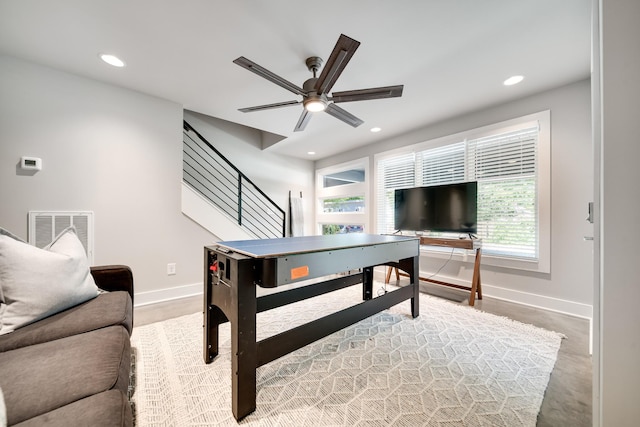 rec room with ceiling fan