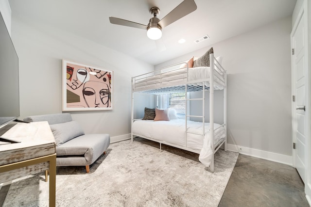 bedroom featuring ceiling fan and concrete flooring