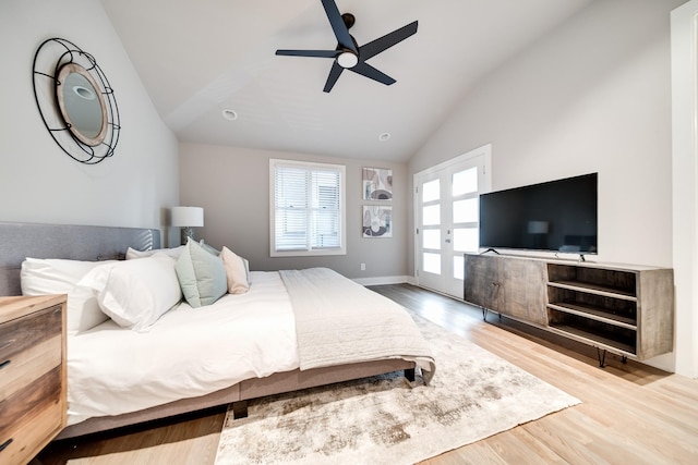 bedroom featuring ceiling fan, wood-type flooring, and vaulted ceiling