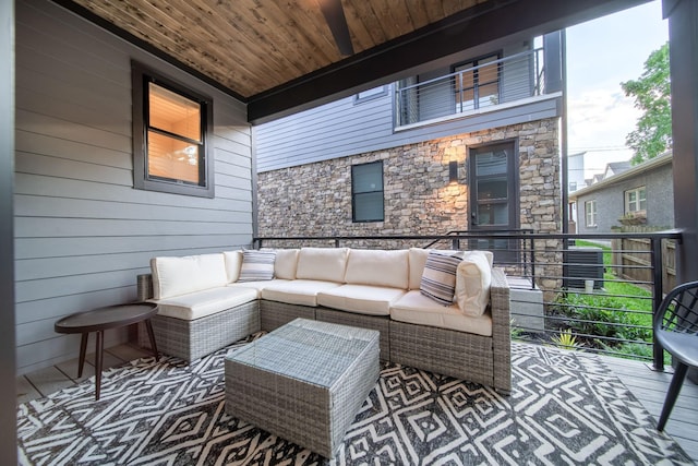 view of patio featuring outdoor lounge area and a balcony