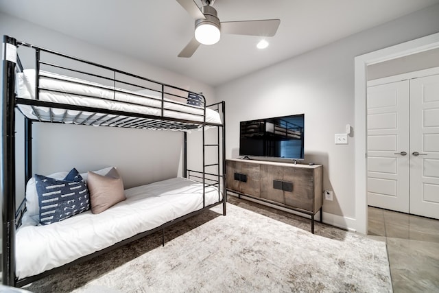 bedroom featuring ceiling fan and a closet