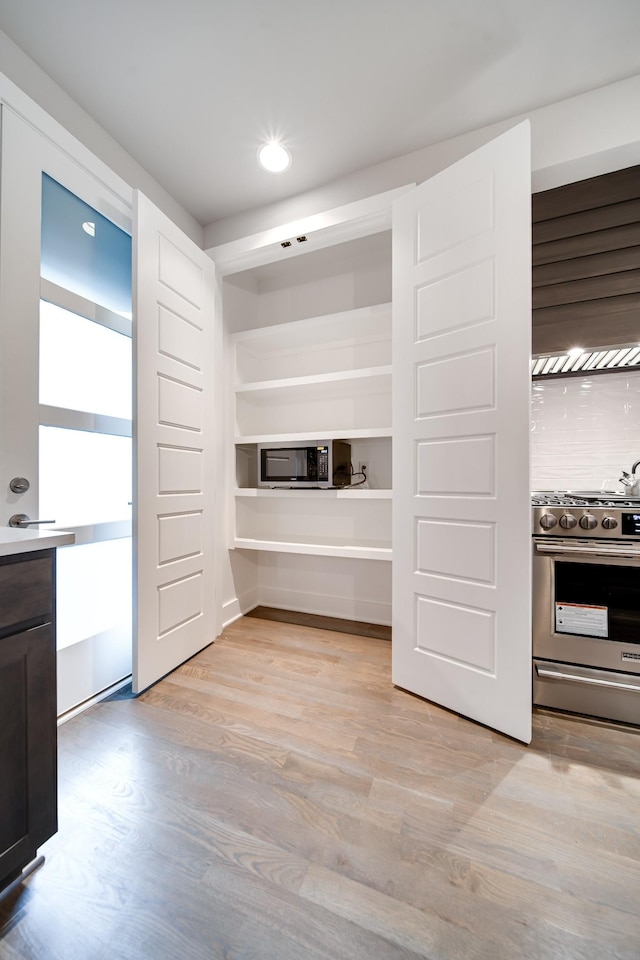 interior space with light wood-type flooring and stainless steel appliances