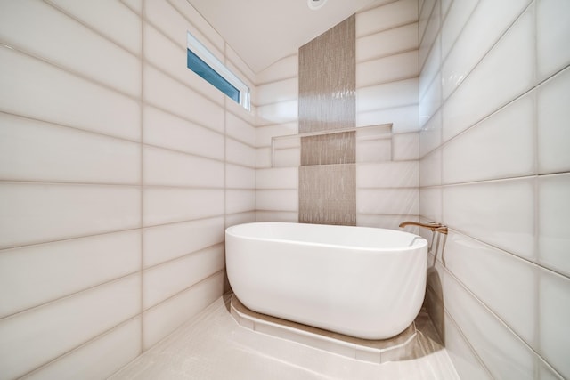 bathroom with a tub to relax in