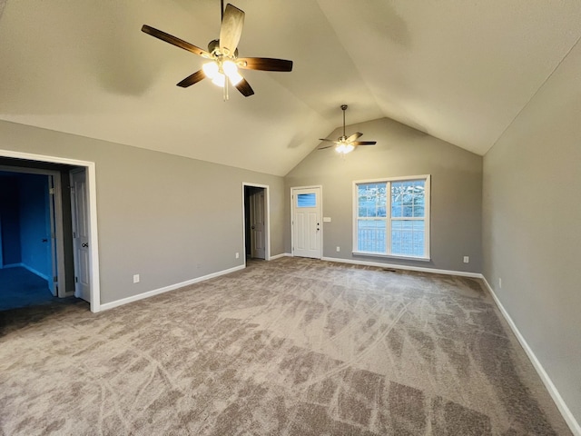 interior space featuring carpet, vaulted ceiling, and ceiling fan