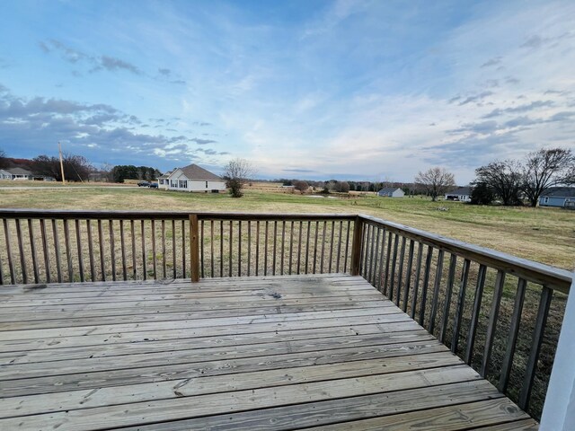 wooden deck with a yard