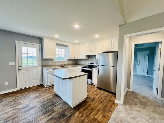 466 White Rd, Leoma, TN 38468 - kitchen featuring freestanding refrigerator, range with electric stovetop, dishwasher, a sink, and white cabinets