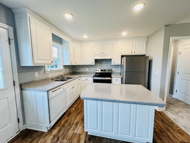 466 White Rd, Leoma, TN 38468 - kitchen featuring appliances with stainless steel finishes, a sink, under cabinet range hood, white cabinetry, and a kitchen island